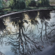 Photo de l'oeuvre "bassin du parc en novembre". Aquarelle paysagère représentant un jardin en hiver, un bassin avec des reflets d'arbres dans l'eau. Vue de la peinture en entier.